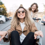 young-women-playing-with-shopping-cart_23-2148495447